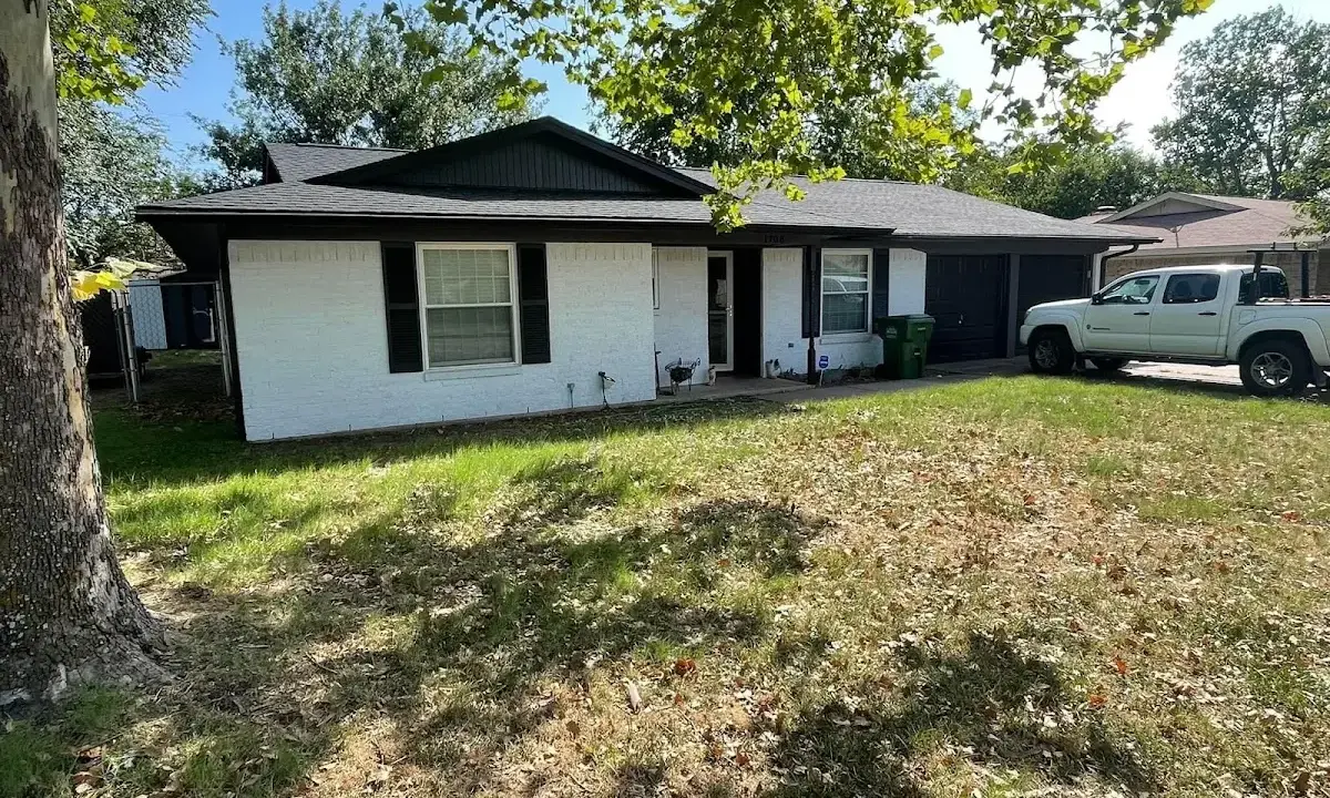 Professional roofing crew working on a residential roof in Beckett Ridge